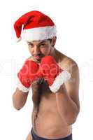 Sexy muscular boxer wearing a Santa Claus hat