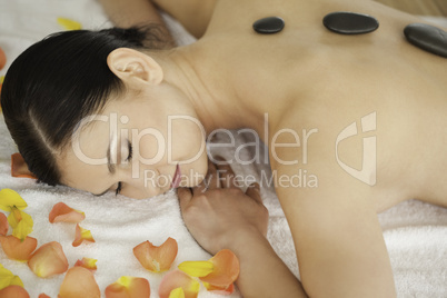 Cute brunette enjoying the procedure of massage
