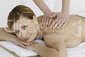 Blond-haired woman getting a massage