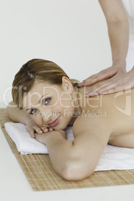 Young blond-haired woman getting a massage