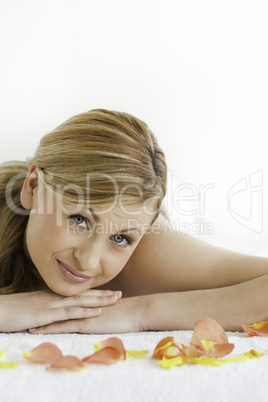 Cute blond-haired woman happy while lying down