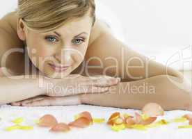 Lovely blond-haired woman happy while lying down