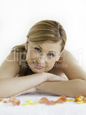 Attractive blond-haired woman happy while lying down