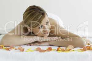 Blond-haired woman happy while lying down