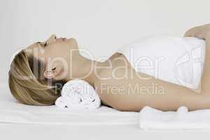 Beautiful blond-haired woman receiving a spa treatment