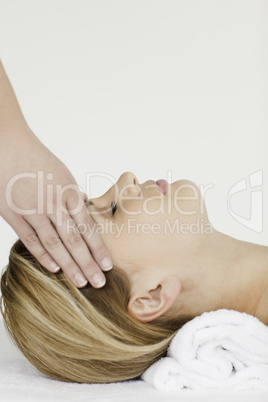 Blond-haired woman receiving a spa treatment