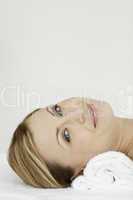 Blond-haired woman lying down