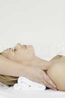 Pretty blond-haired woman lying down