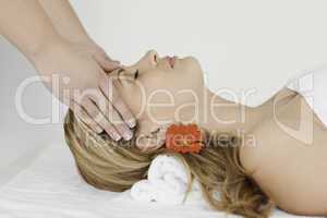 Young and lovely blond-haired woman lying down
