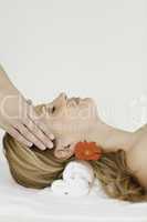 Young and beautiful blond-haired woman lying down