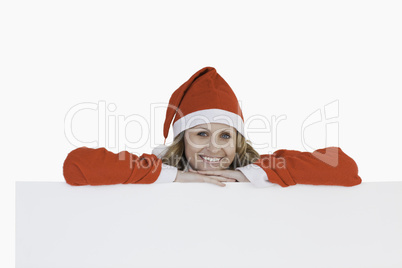 Cute blond-haired woman dressed as Santa Claus