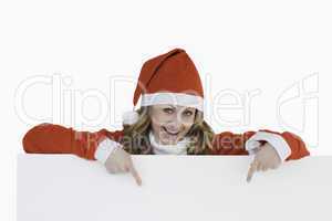 Attractive blond-haired woman dressed as Santa Claus