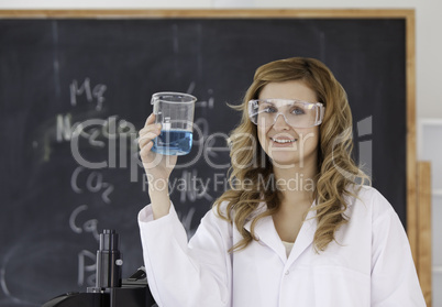 Cute scientist looking at the camera