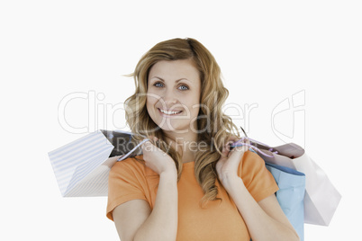 Blond-haired woman showing her shopping
