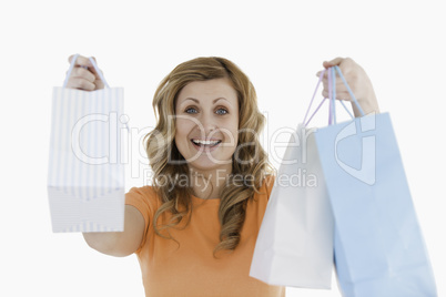Happy blond-haired woman having done her shopping