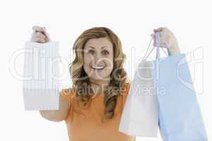 Happy blond-haired woman having done her shopping