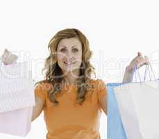 Attractive blond-haired woman showing her shopping