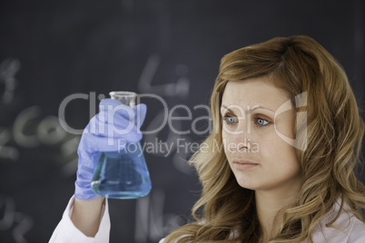 Cute female scientist conducting an experiment