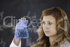 Cute female scientist conducting an experiment