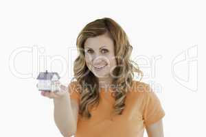 Attractive woman holding an house model