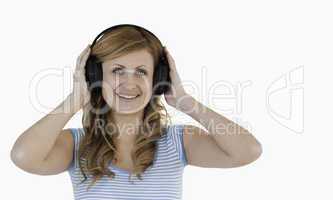 Attractive blond-haired woman listening to music