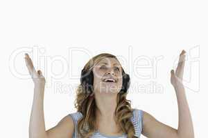 Isolated blond-haired woman happy while listening to music