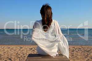 Woman sitting on beach