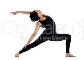 woman stand in yoga pose - warrior asana