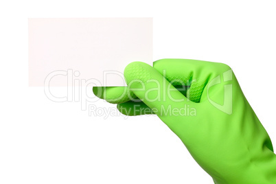 Hand in green glove showing business card