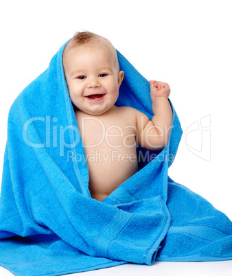 Cute child wrapped in blue towel