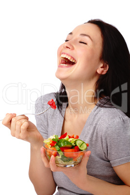 Young attractive woman eats vegetable salad