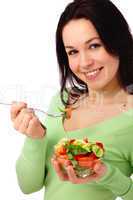 Young attractive woman eats vegetable salad