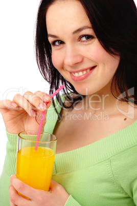 Young attractive woman drinks orange juice