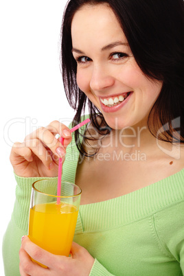 Young attractive woman drinks orange juice