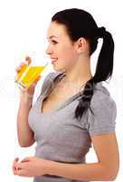 Young attractive woman drinks orange juice