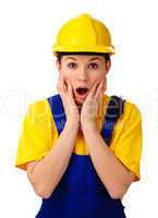 Construction girl holding her face in astonishment