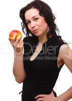 Young attractive woman with red apple