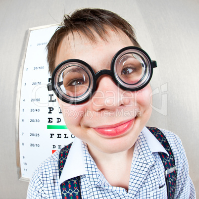 person wearing spectacles in an office at the doctor