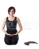 Young woman relax after yoga with beads isolated