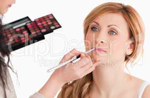 woman getting make up