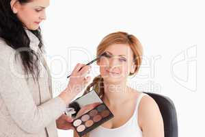 woman getting make up