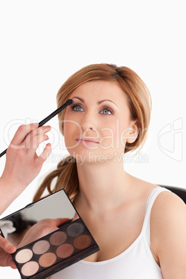 woman getting make up