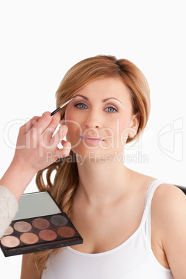 woman getting make up