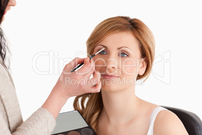woman getting make up