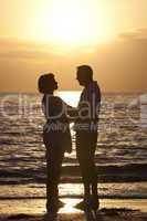Senior Man & Woman Couple on Beach at Sunset