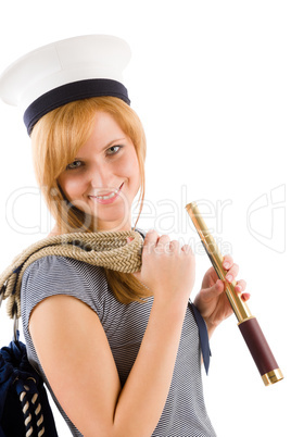 Young marine woman with spyglass in sailor hat