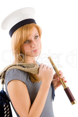 Young marine woman with spyglass in sailor hat