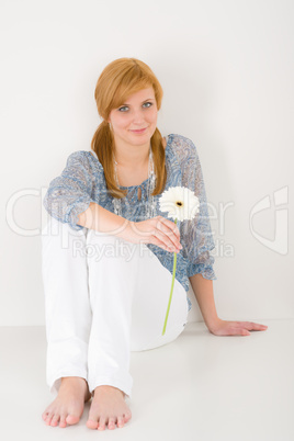 Romantic young woman hold gerbera daisy