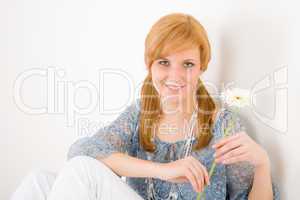 Romantic young woman hold gerbera daisy