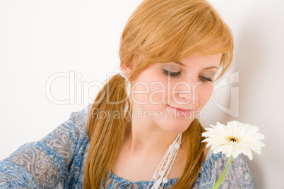 Romantic young woman hold gerbera daisy